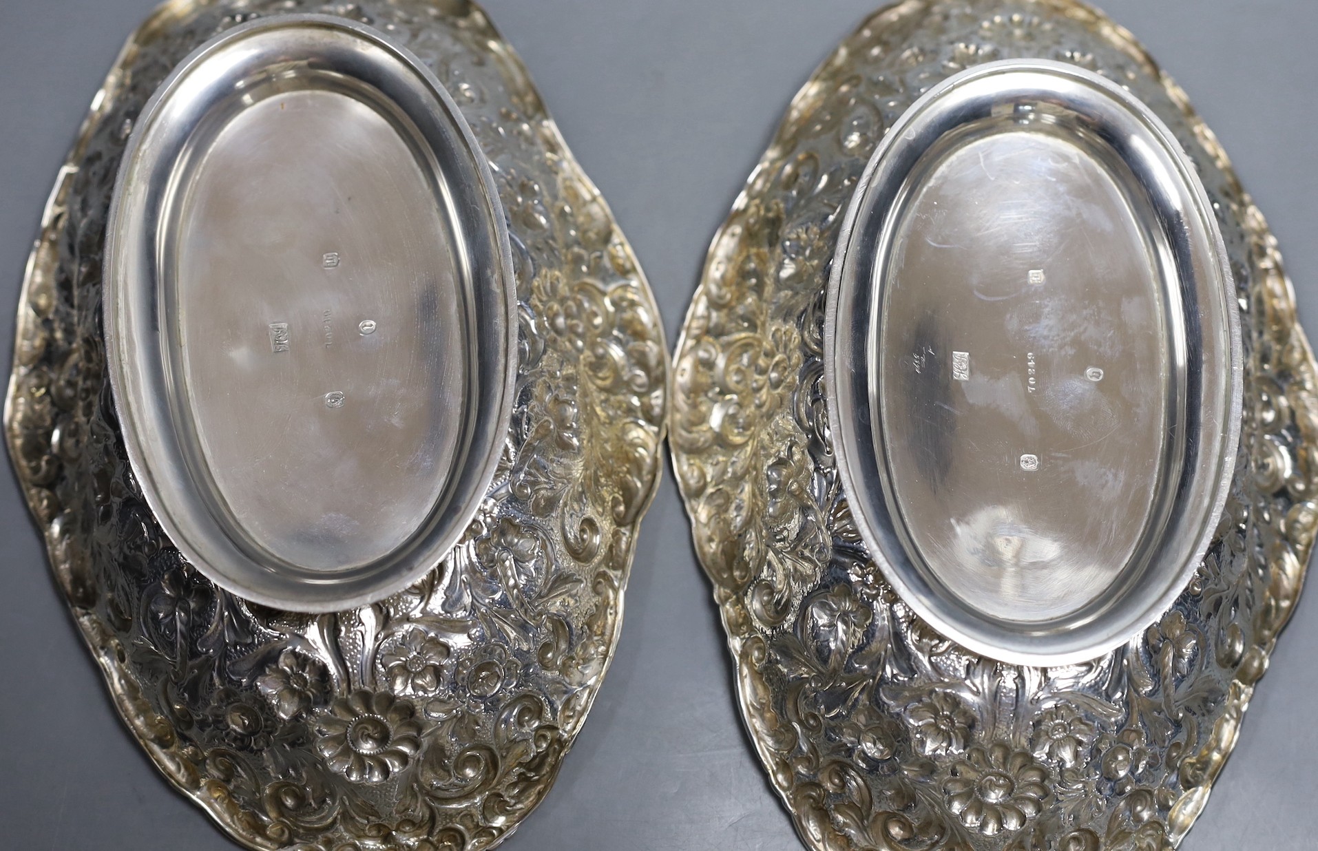 A pair of late Victorian Scottish repousse silver oval dishes, Hamilton & Inches, Edinburgh, 1900, 25cm, 17oz.